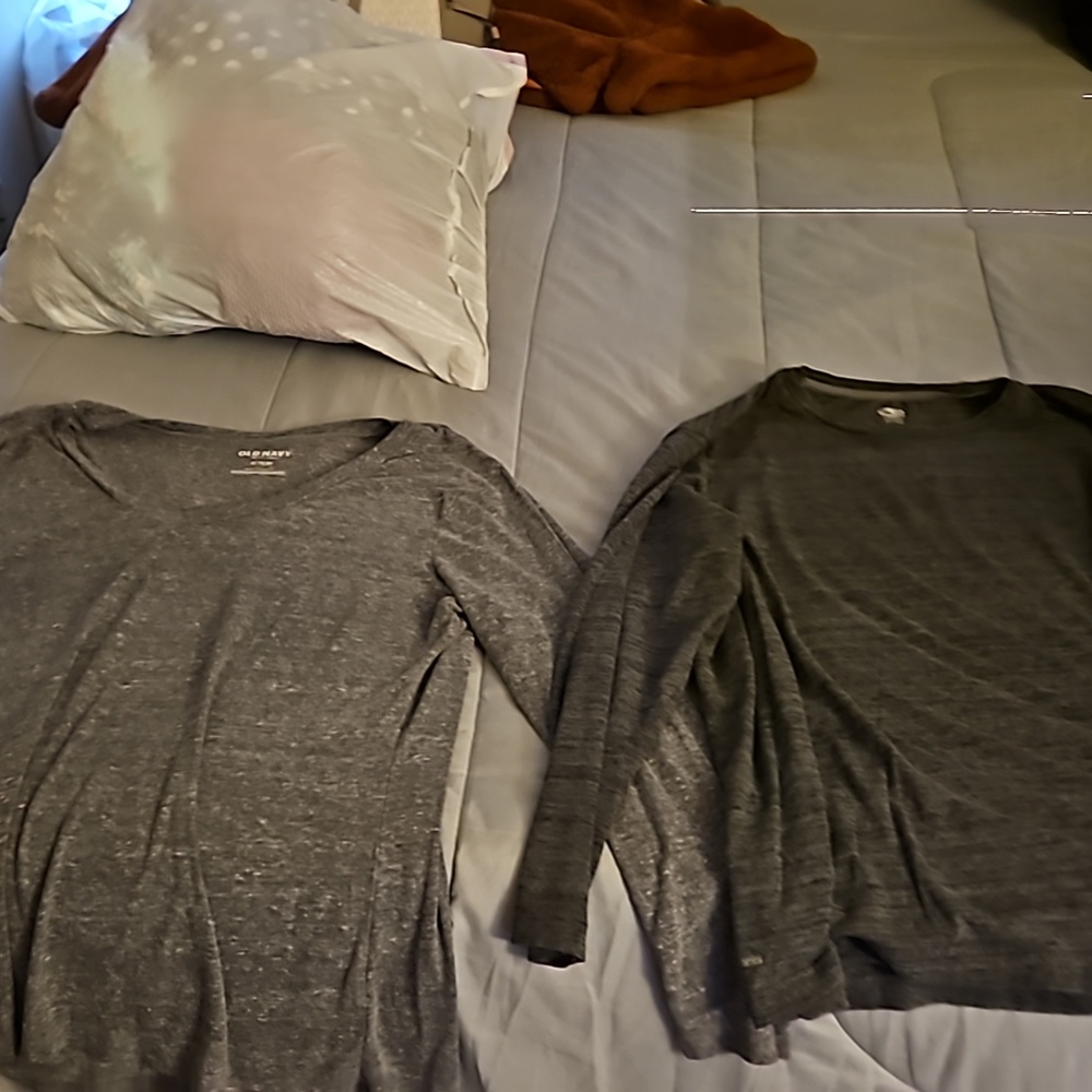 Two gray long sleeve shirts
